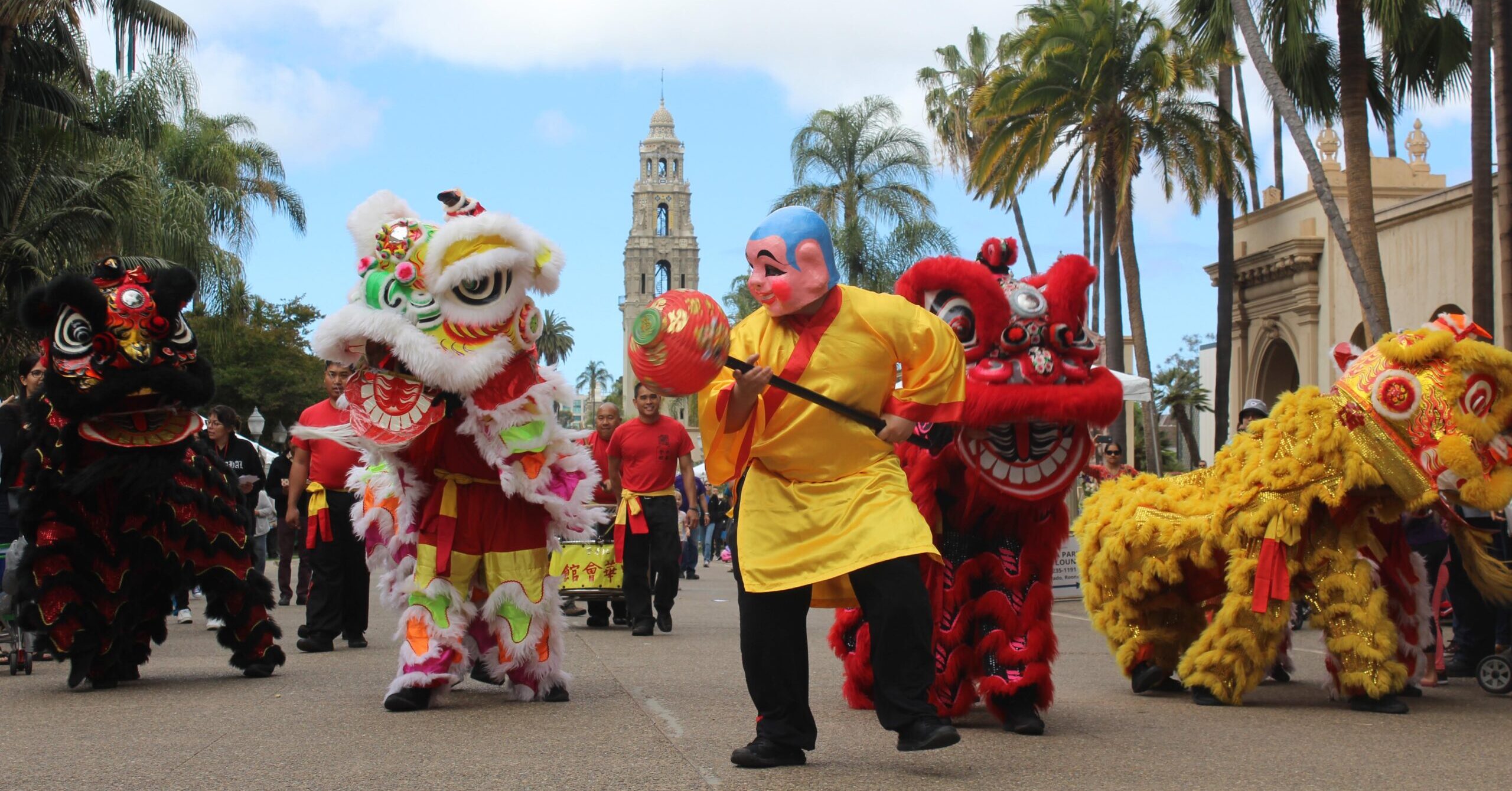 Lion dancers parading down the main plaza at Balboa Park.